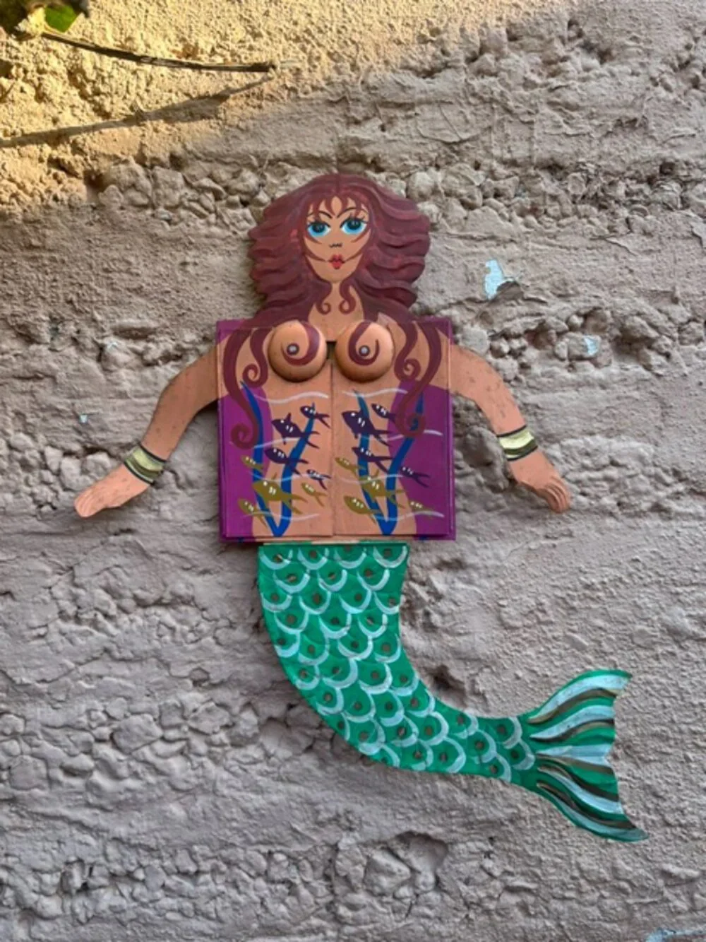 Redheaded painted tin mermaid with chest drawers that open to a mirror.